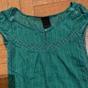 Somewhat sheer green blouse with Crochet detail on the sides and the chest Sz sm